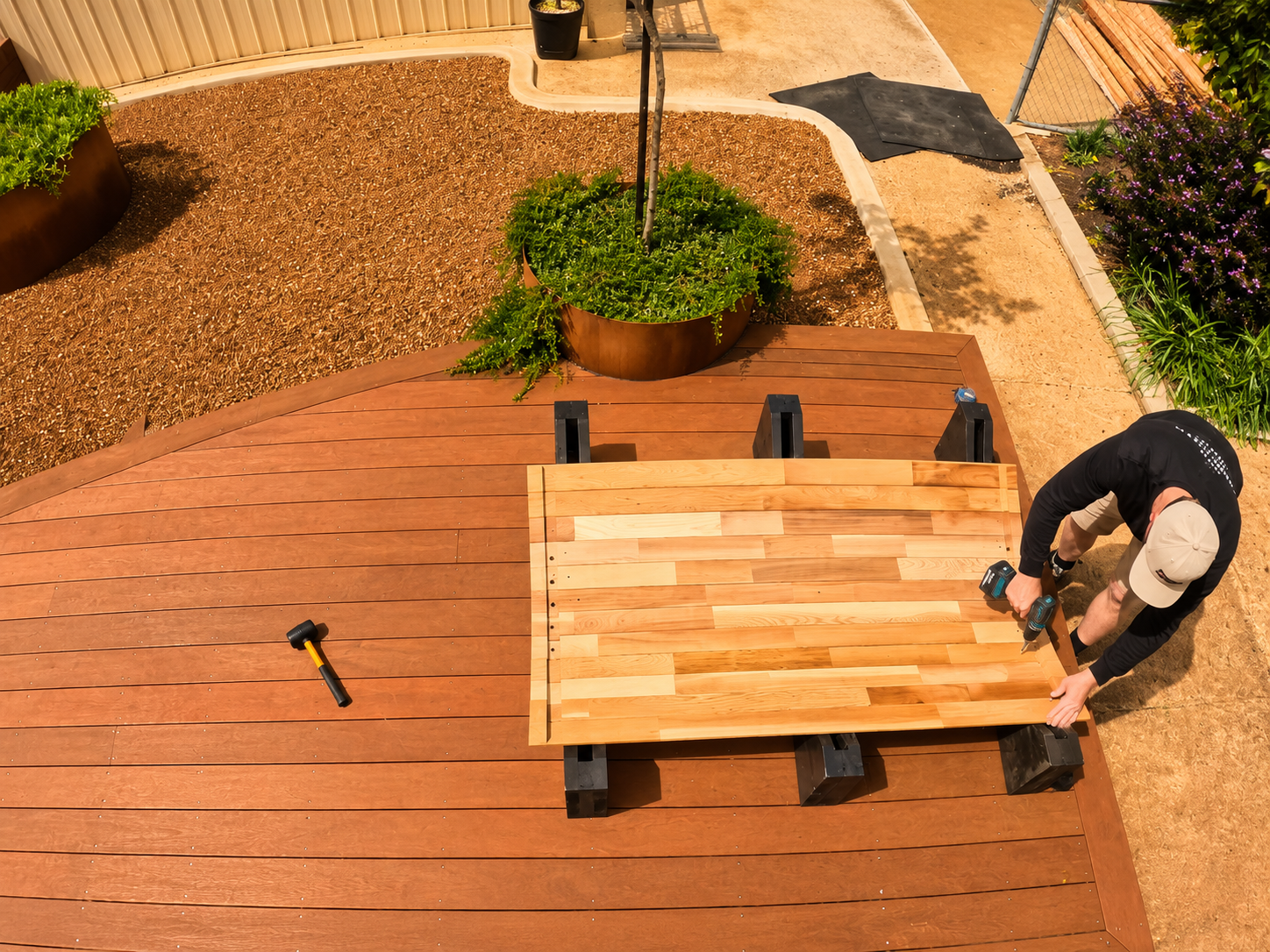 Person building sauna on a deck
