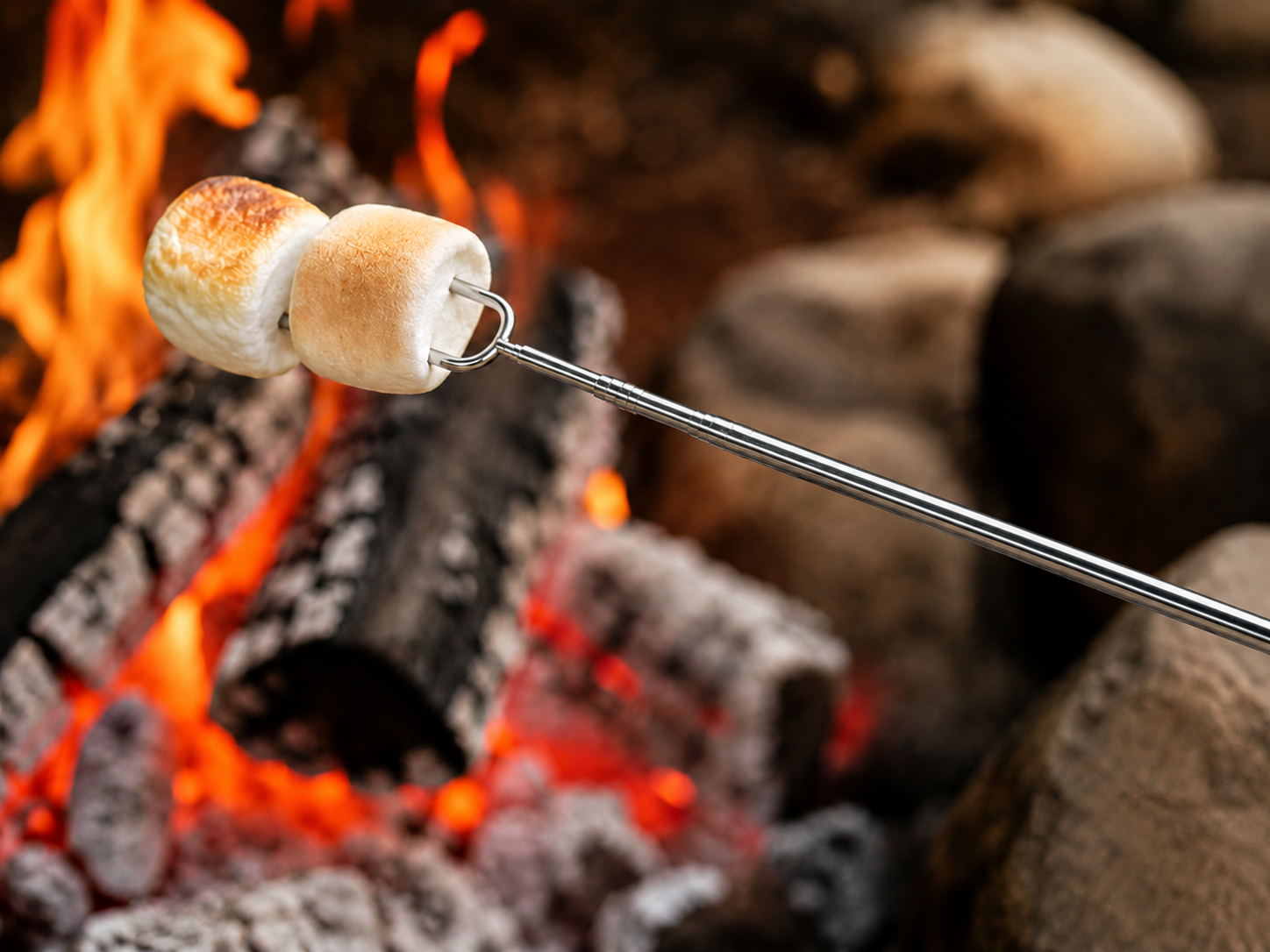 Marshmellow on fork over fire.png