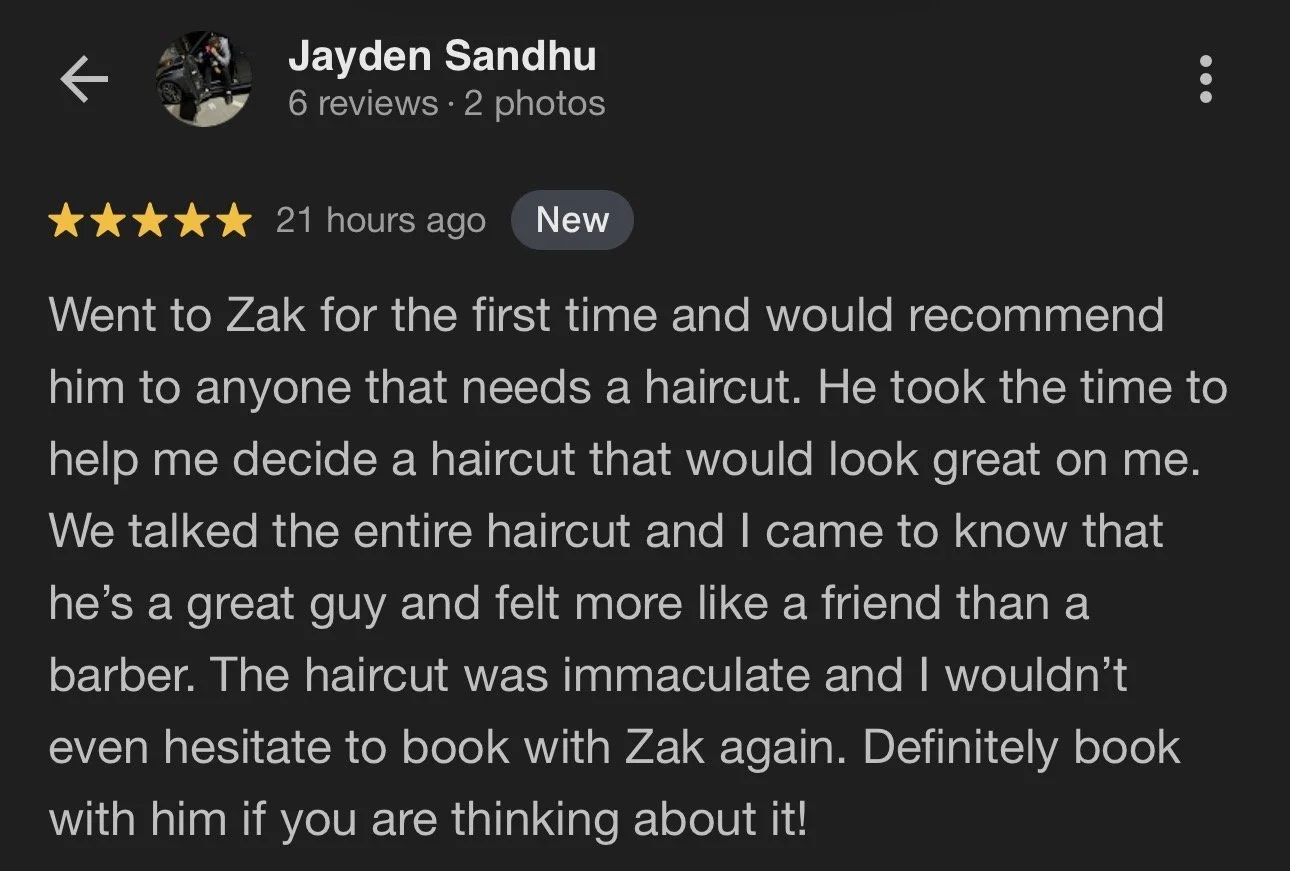 Screenshot of a Google reviews page with a five-star review about a barber named Zak, featuring a profile picture of a man in black clothing, riding a motorcycle.