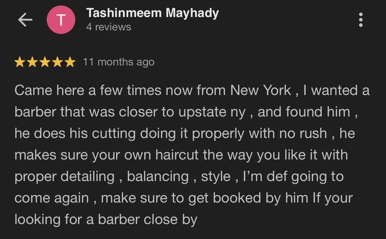 Screenshot of a positive online review for a barber named Tashinmeem Mayhady, praising his skill and professionalism.