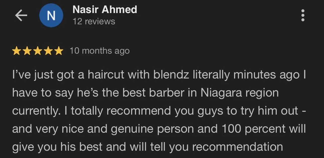 Screenshot of a Google review for a barber named Nasir Ahmed, showing five stars and positive feedback about a recent haircut experience.