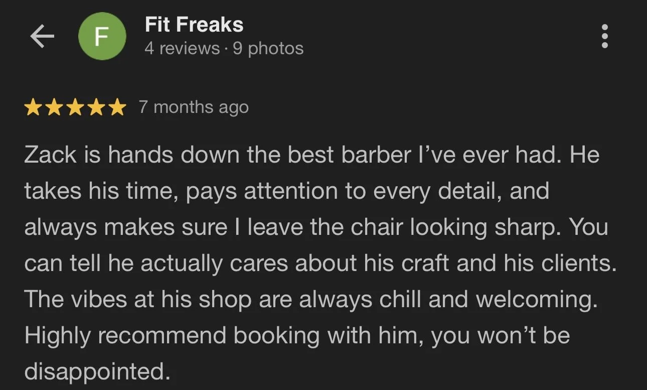 Screenshot of a Google review for a barber named Zack at Fit Freaks, praising Zack's attention to detail, craft, and customer care.