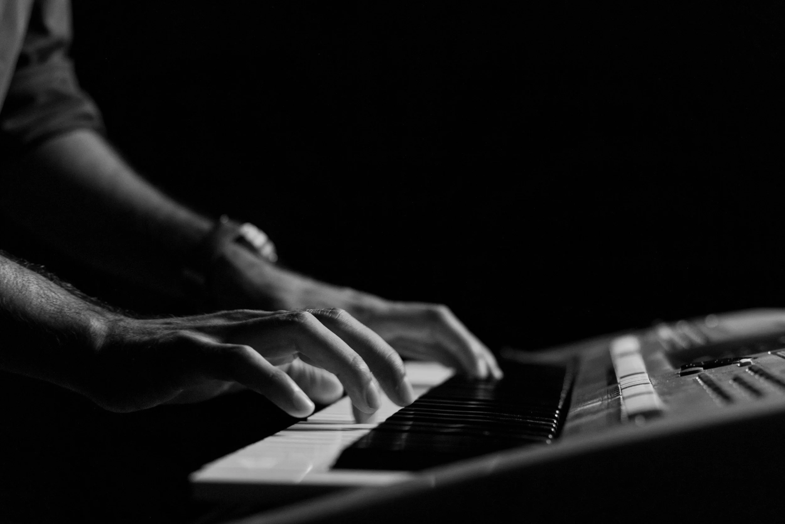 Air Audio producer making beats using a keyboard.
