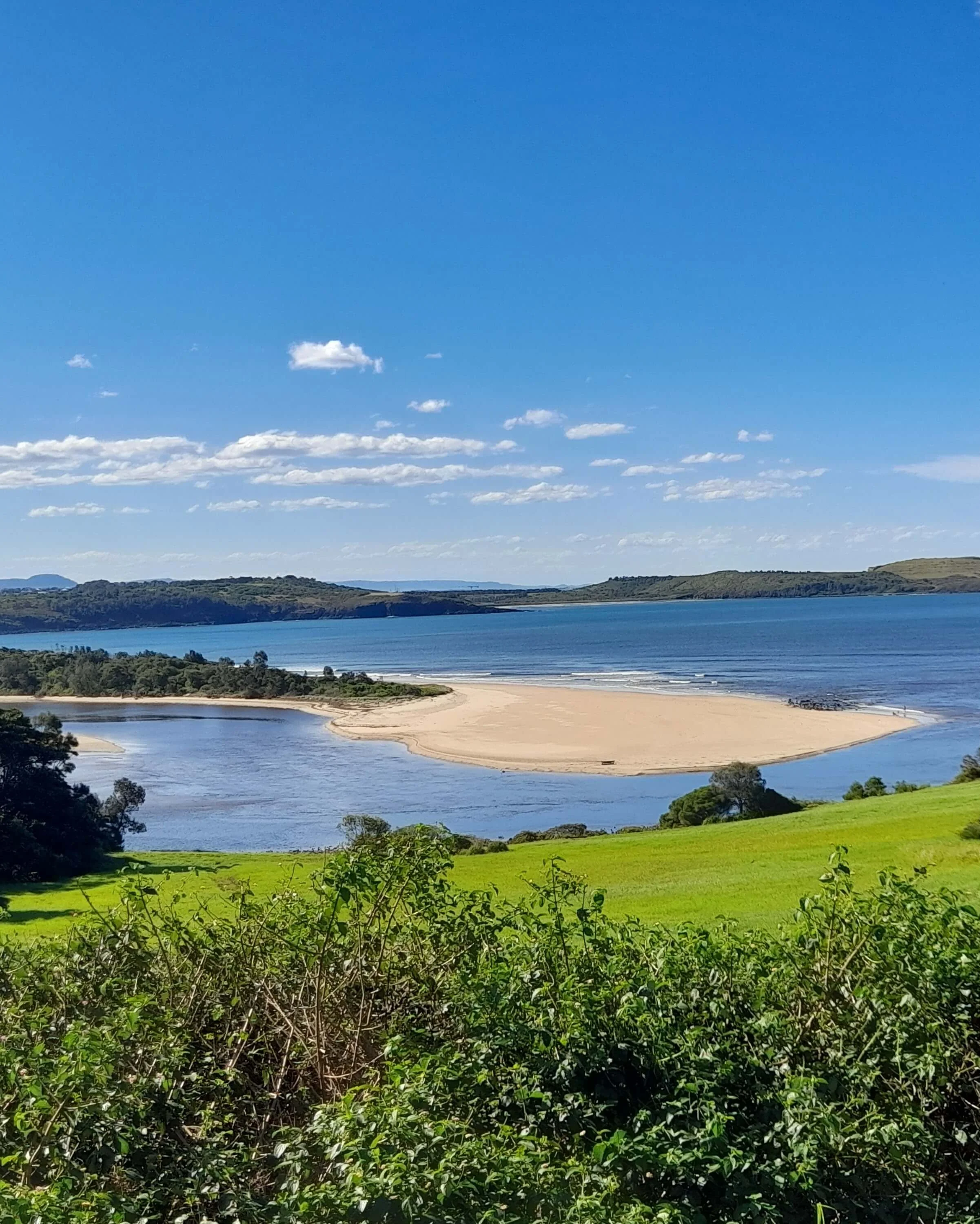 Panoramic view of the Minnamurra River inlet and sandbank on the South Coast of NSW.