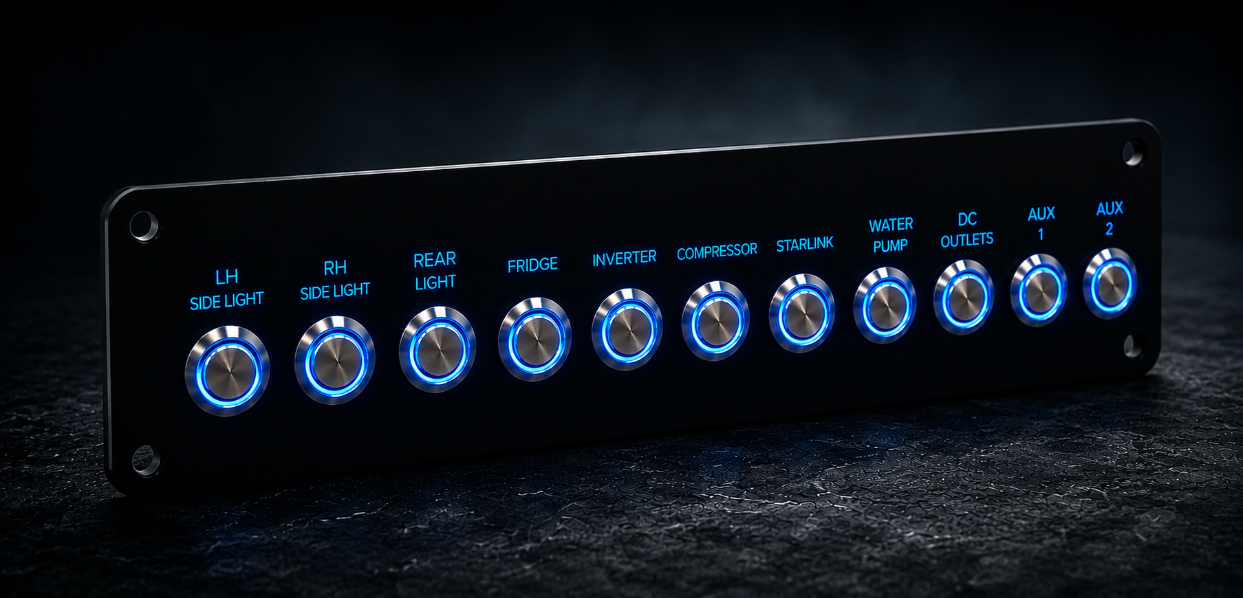Custom 12V switch panel with illuminated push-button switches for lighting, fridge, inverter, Starlink, water pump and auxiliary power systems.