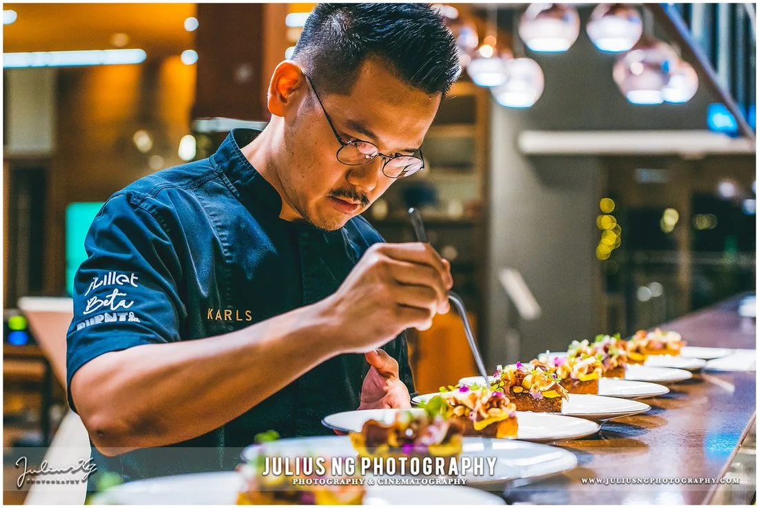 Renowned Michelin Star Chef 2024, Raymond Tham carefully plating signature dishes for guests at Garden by the Coast, The Els Club Desaru Coast.