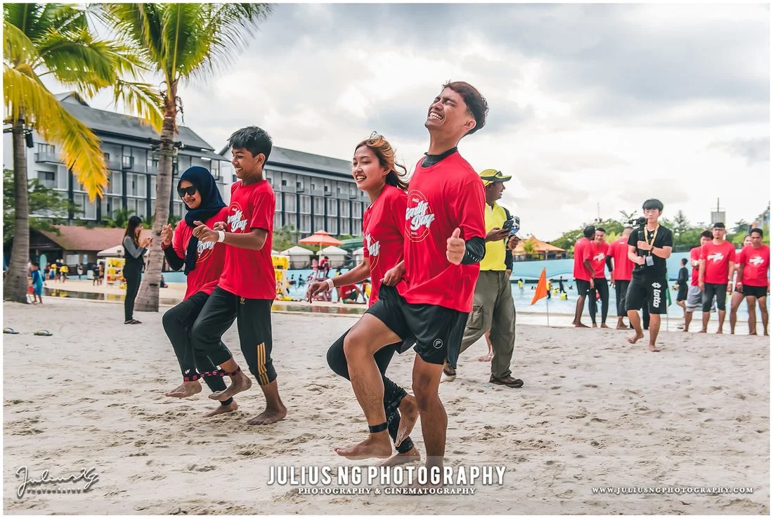 Coca-Cola employees taking part in team building activities during a corporate family day at Adventure Waterpark Desaru Coast, photographed by Julius Ng Photography.