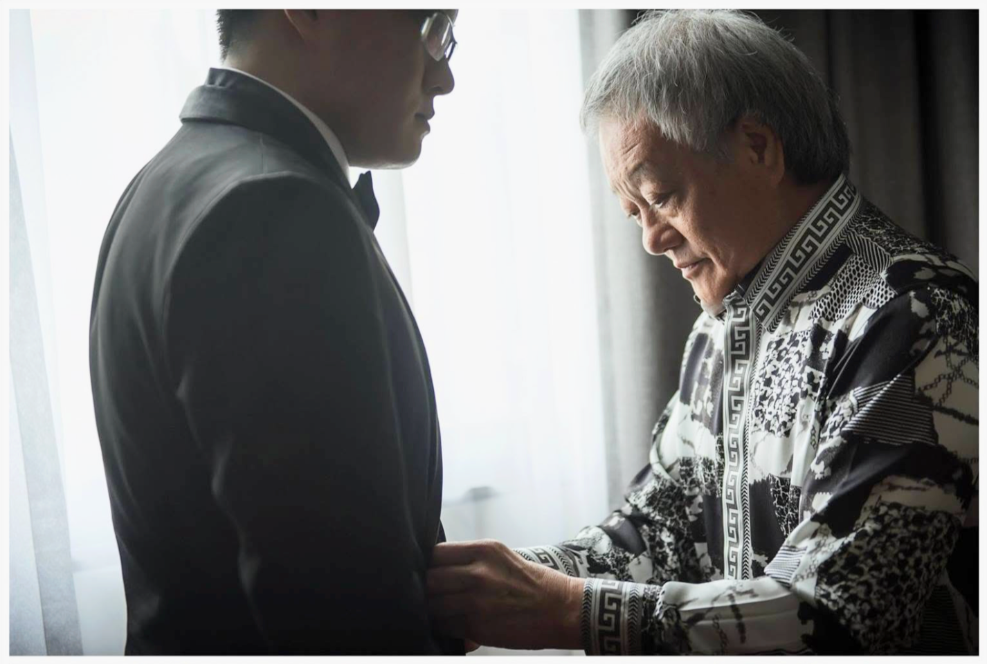 Jasper's father helping him prepare before his wedding ceremony
