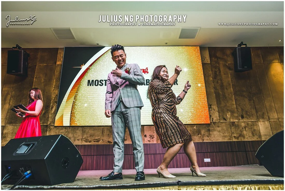 Best Dressed Award winners celebrating on stage during the Mah Sing Annual Sales Award Dinner, photographed by Julius Ng Photography.
