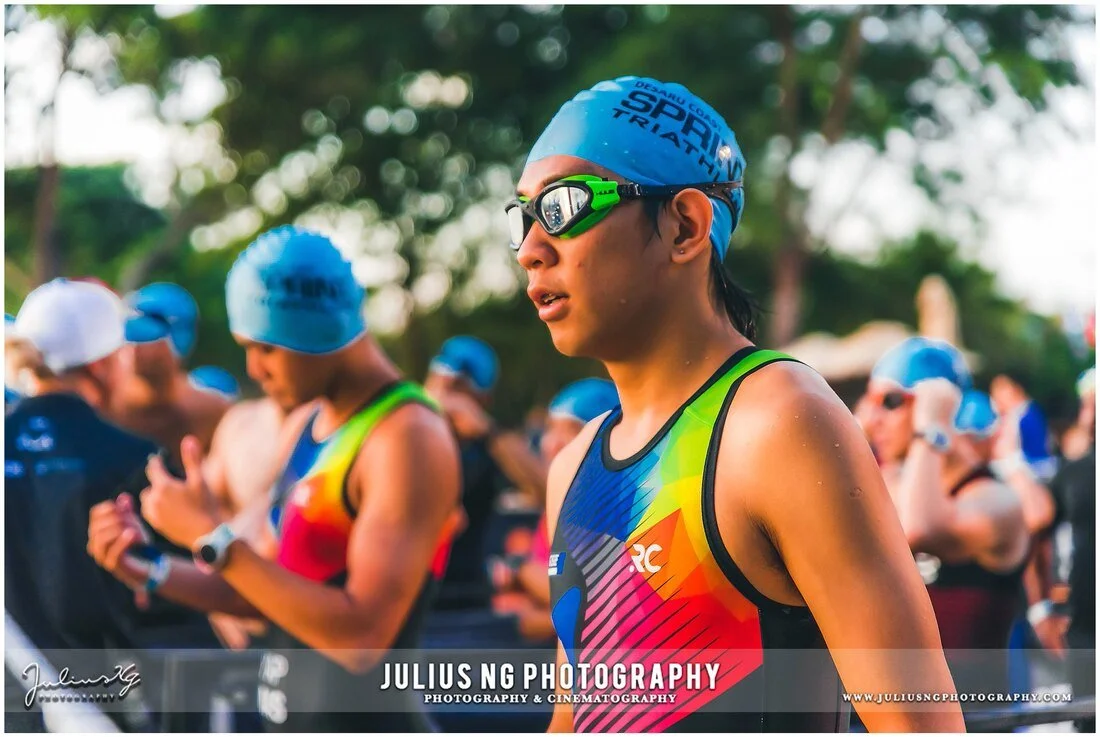 Triathlete preparing for the swim start during Ironman Desaru Coast, photographed by Julius Ng Photography.