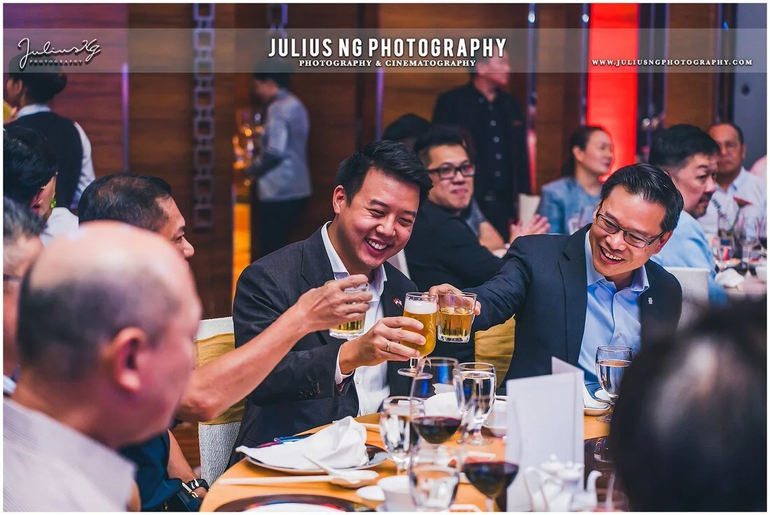 Professional corporate event photography capturing business networking and guest interactions at UOC Customer Appreciation Dinner