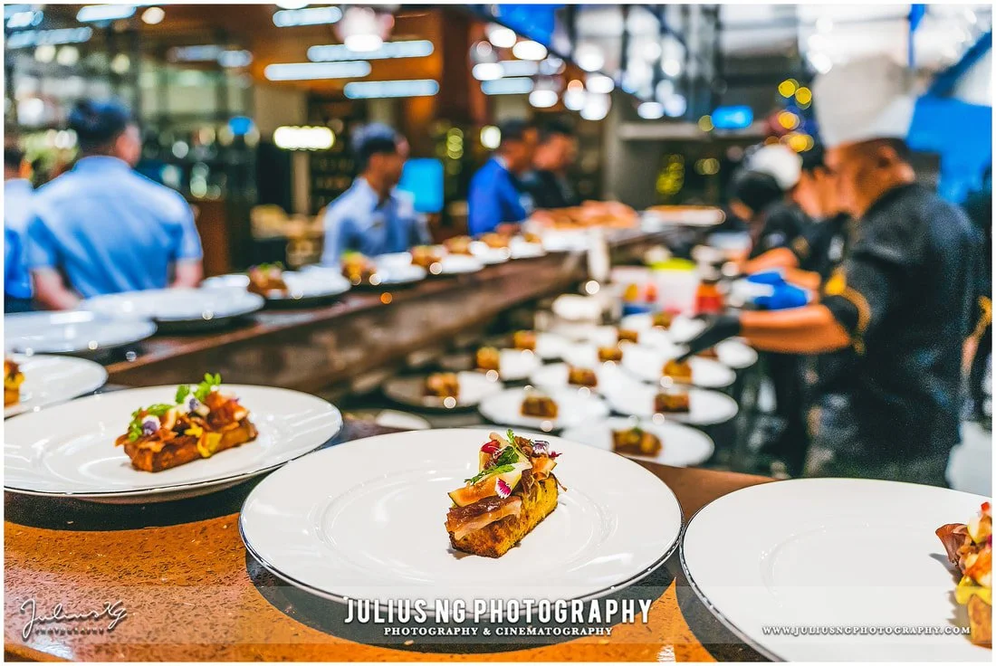 Fine dining dishes prepared in the open kitchen during the Garden by the Coast culinary experience at The Els Club Desaru Coast.