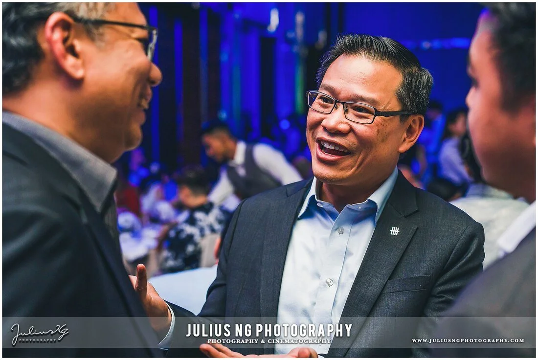 Corporate networking event photography capturing business executives during UOC Customer Appreciation Dinner.