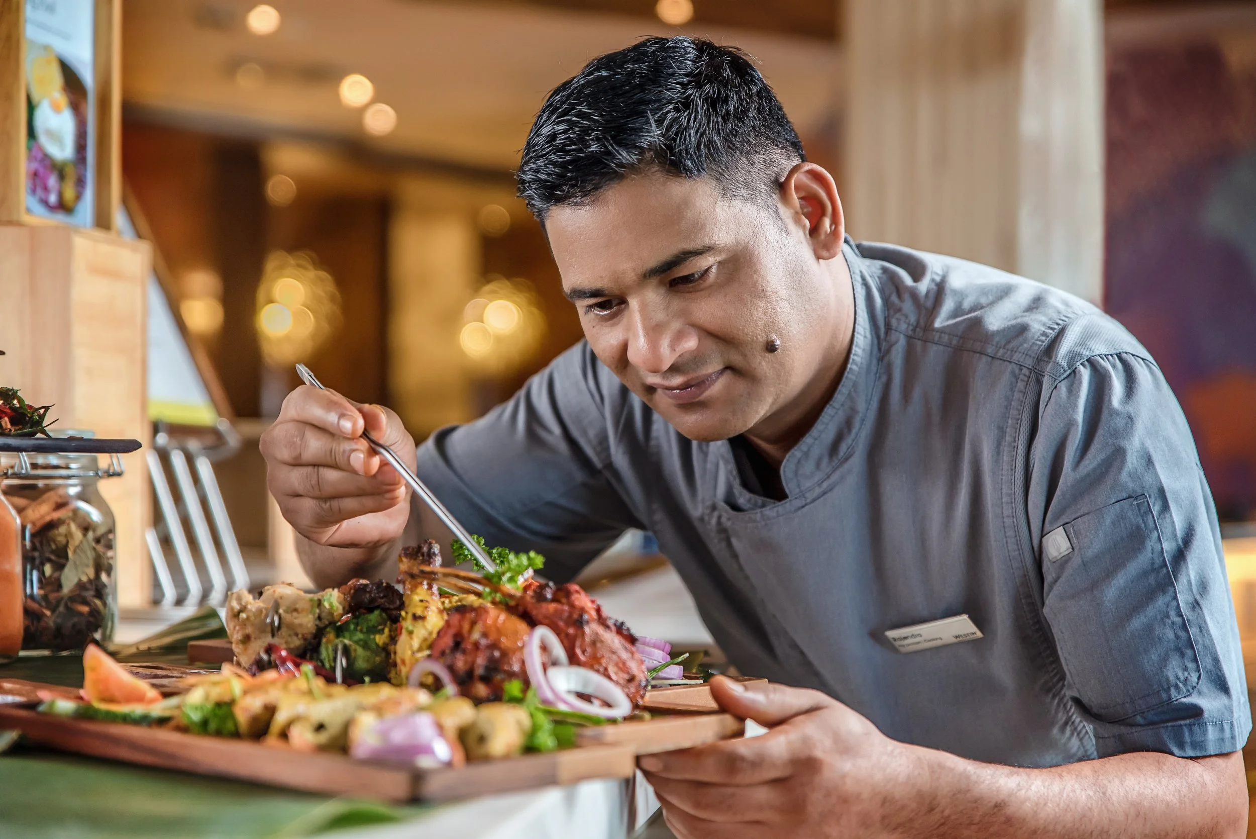 Chef preparing a dish at The Westin Desaru Coast Resort