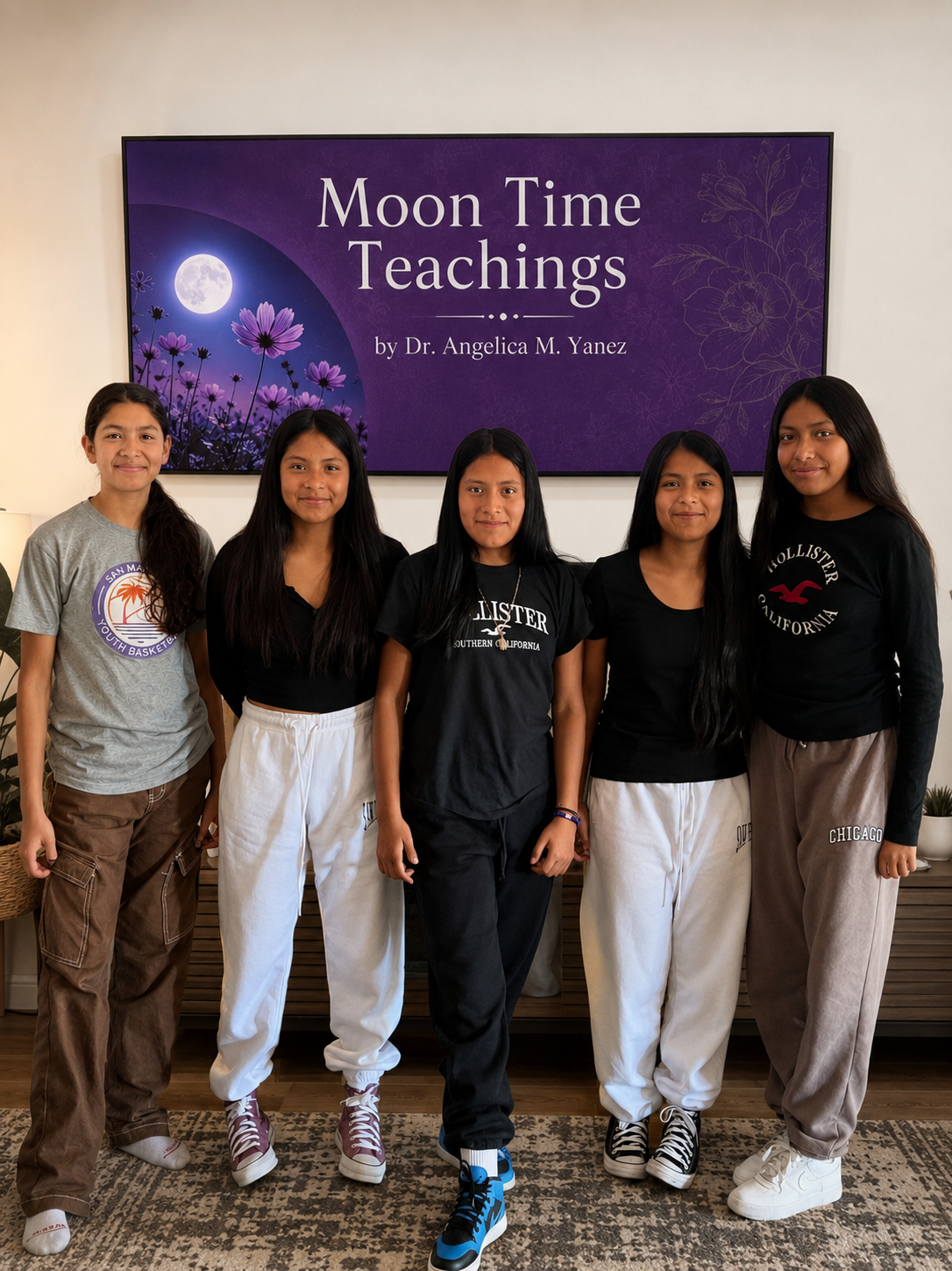 Five young women standing in front of a purple screen with the text 'Moon Time Teachings by Dr. Angelica M. Yanez', all dressed casually.