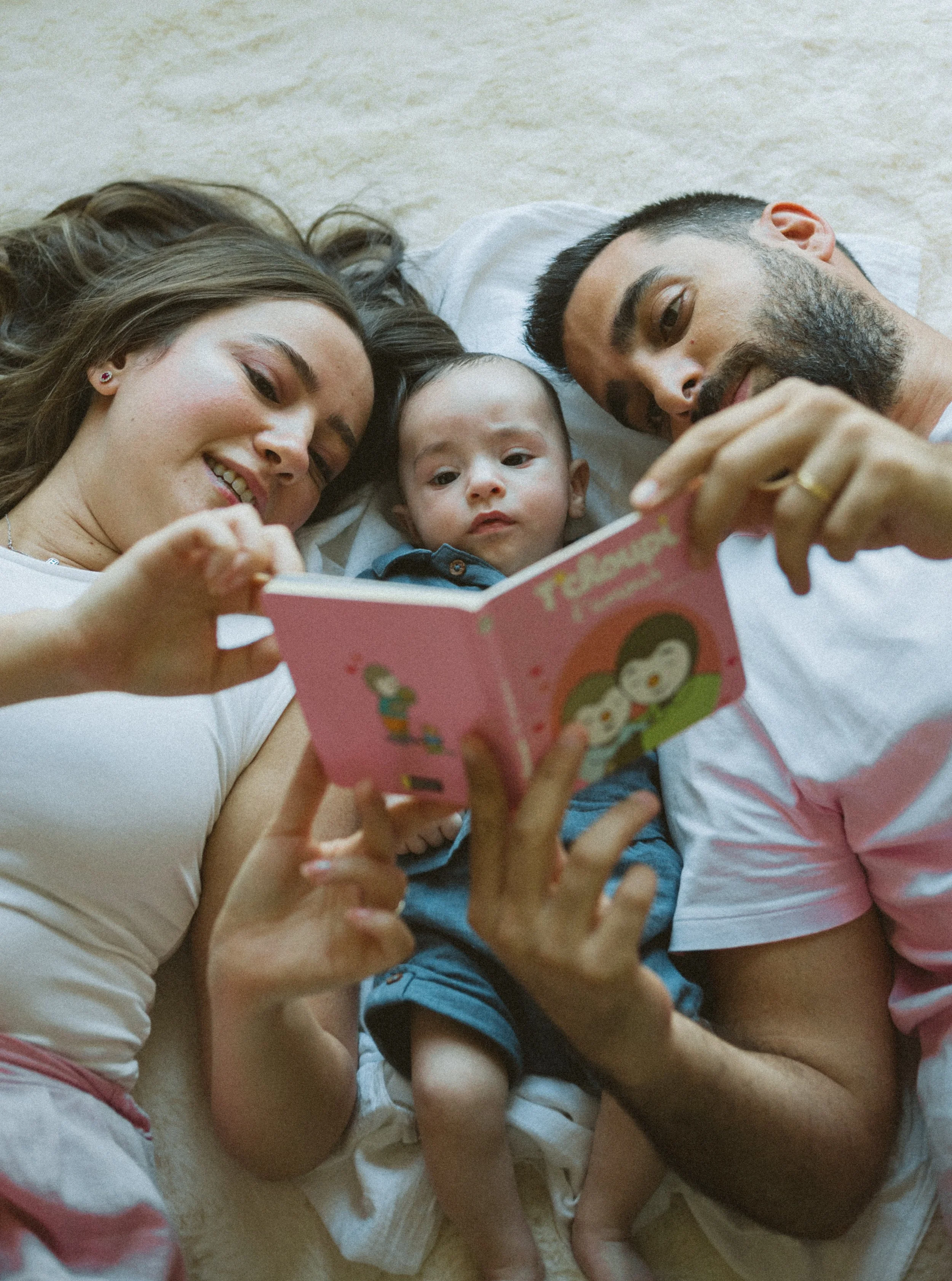 Family relaxing together at home during a documentary family photography session in Dubai. 