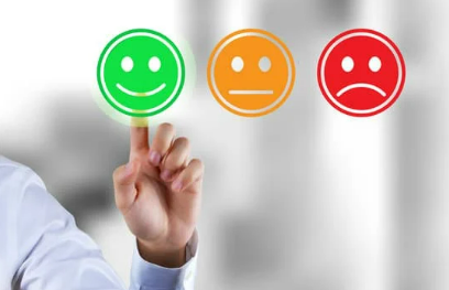 Person pressing emojis happy, sad, neutral