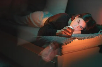 lonely teenager looking at phone