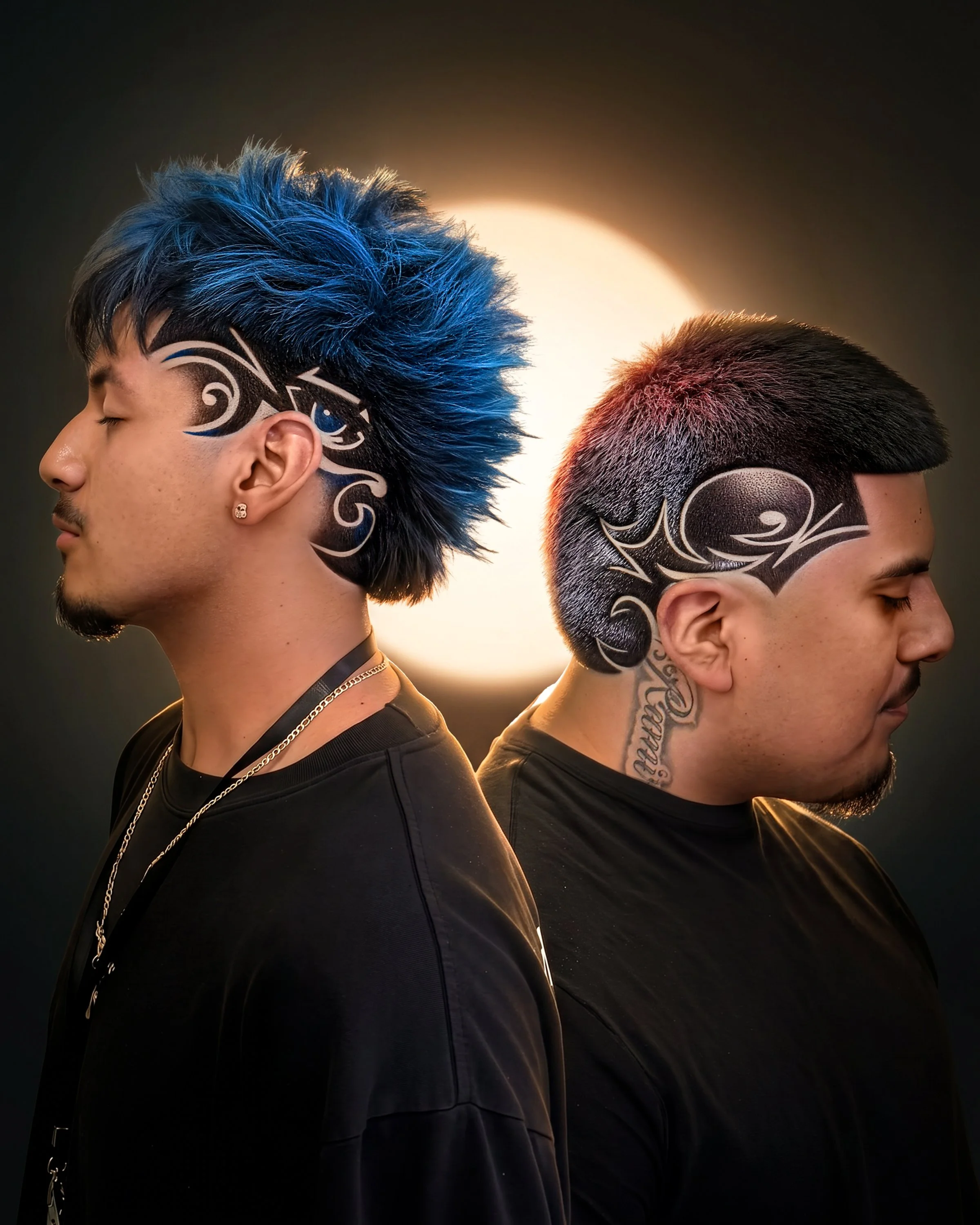 Two young men with modern hairstyles and face tattoos, facing opposite directions with eyes closed, illuminated by a bright circular light in the background.