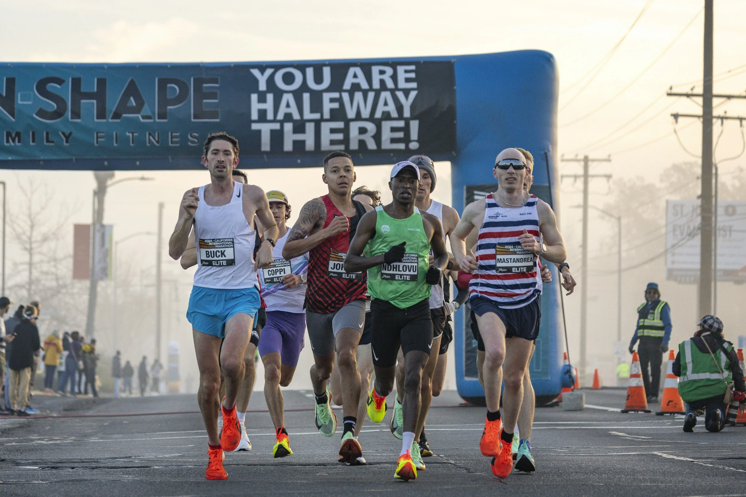 Runners competing in a mass participation road race, representing the Race Strategy Session coaching service