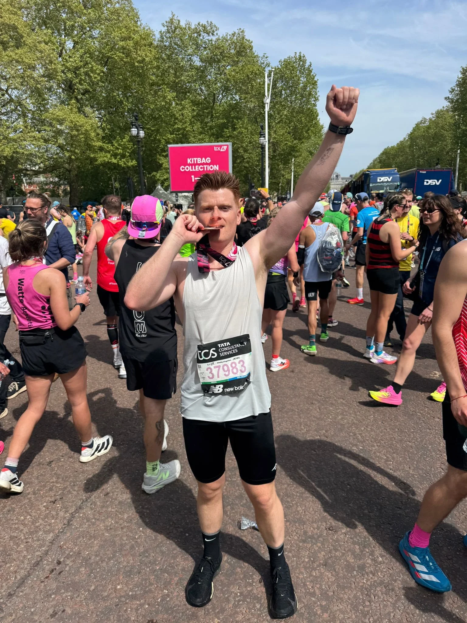 Jersey runner celebrating with a London Marathon medal after progressing from beginner running to marathon training.