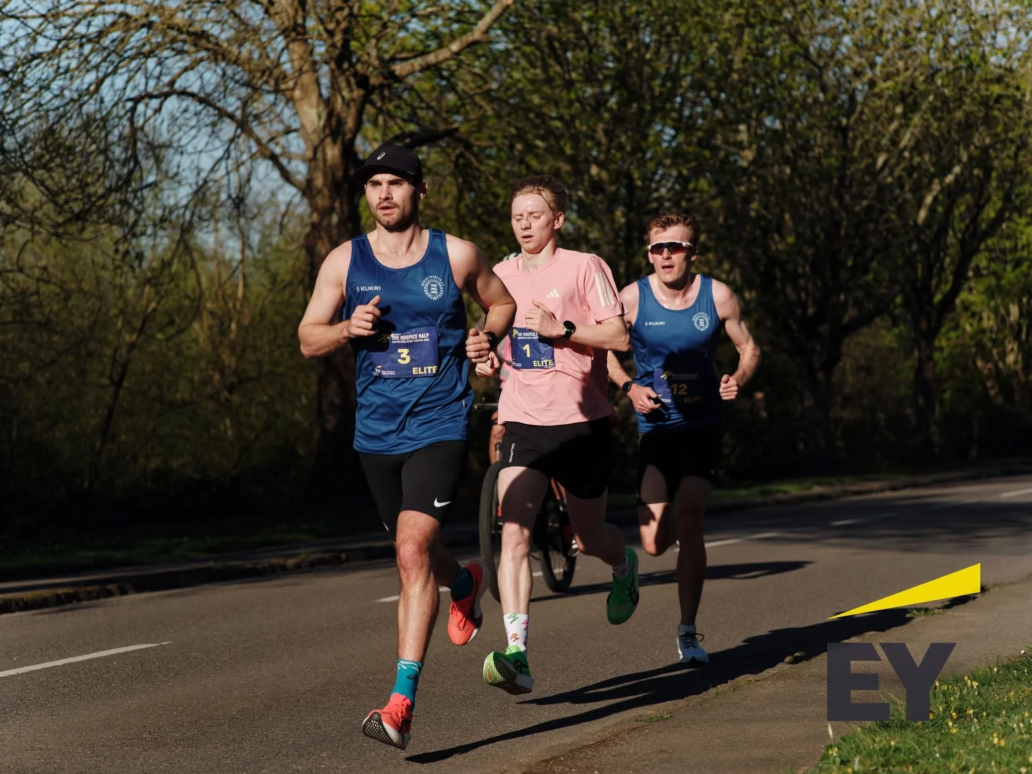 Group of runners competing in a road race
