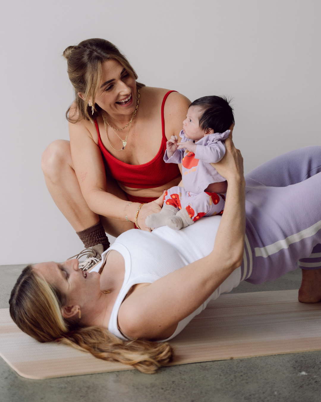 Mum and baby together in a Mums and Bubs class at Heat Byron Bay