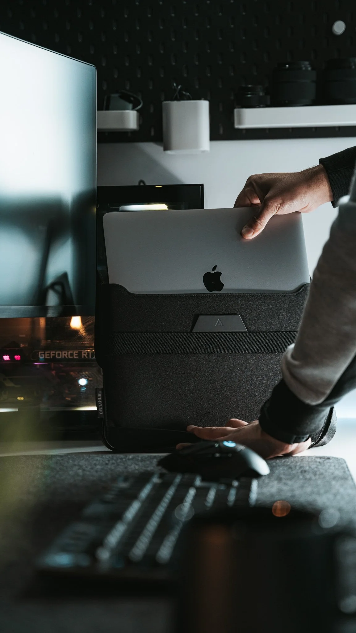 MacBook Pro being placed inside Delta Hub Laptop Bag