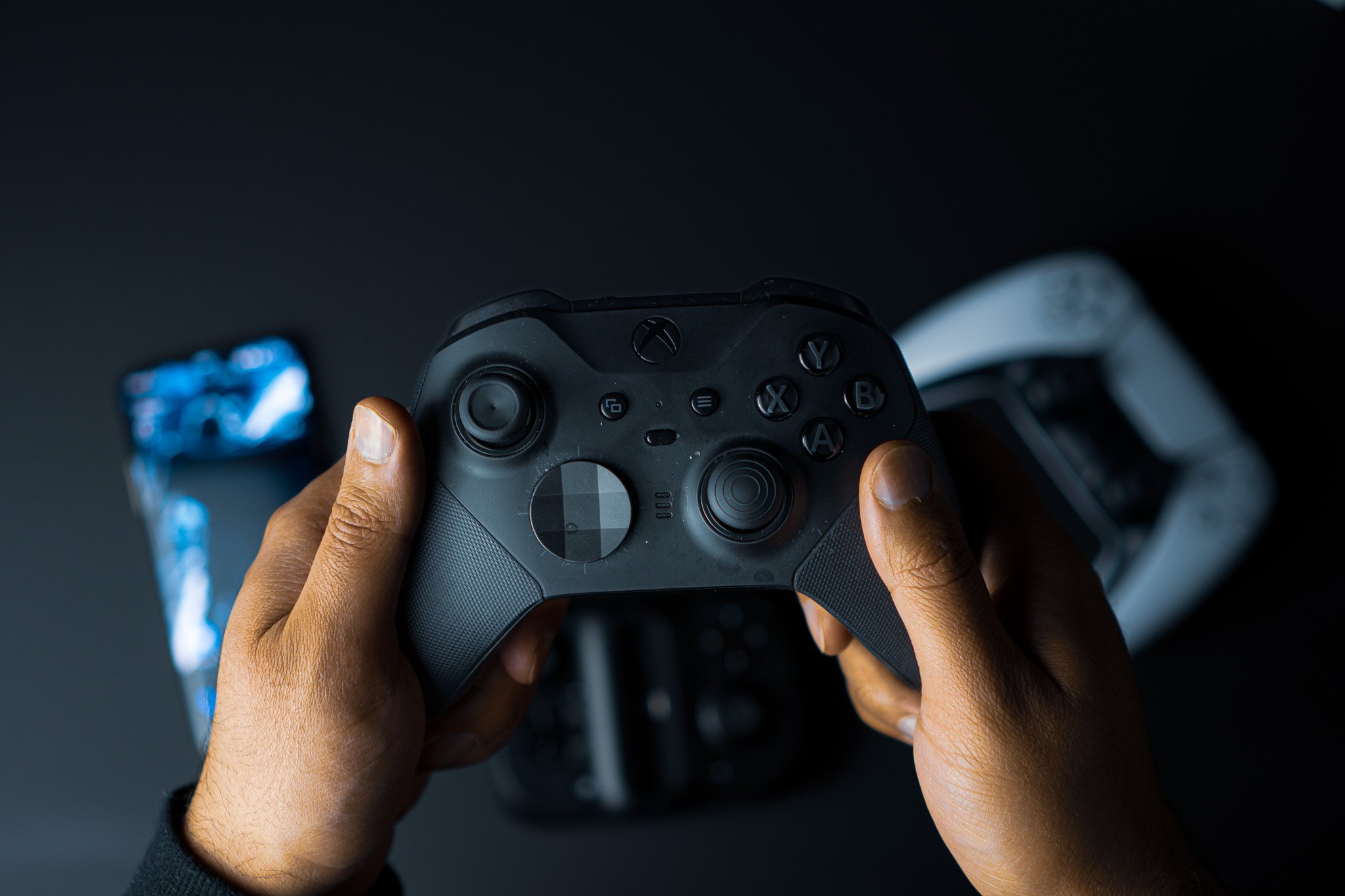Holding the black Xbox Elite controller