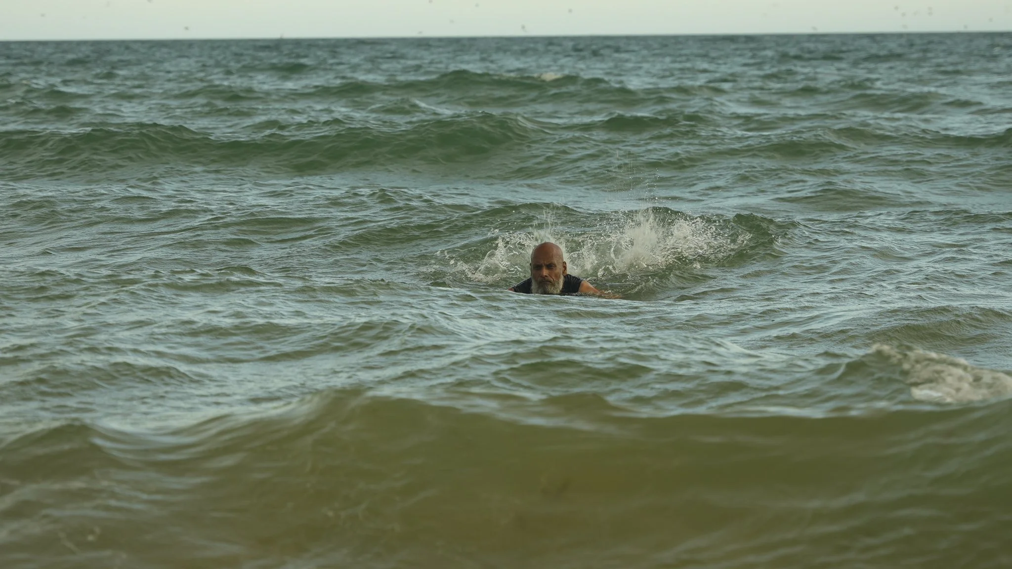 Swimming deep in the waters at Boscombe Beach