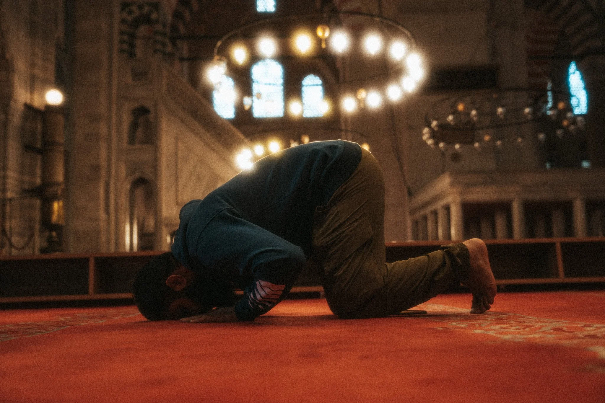 Praying inside the Blue Mosque
