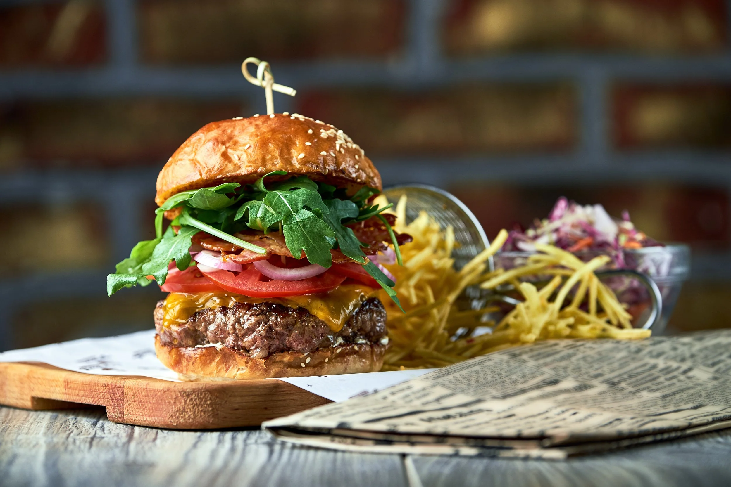 burger-with-bacon-served-with-red-cabbage-salad-an-2023-11-27-05-23-29-utc.jpg