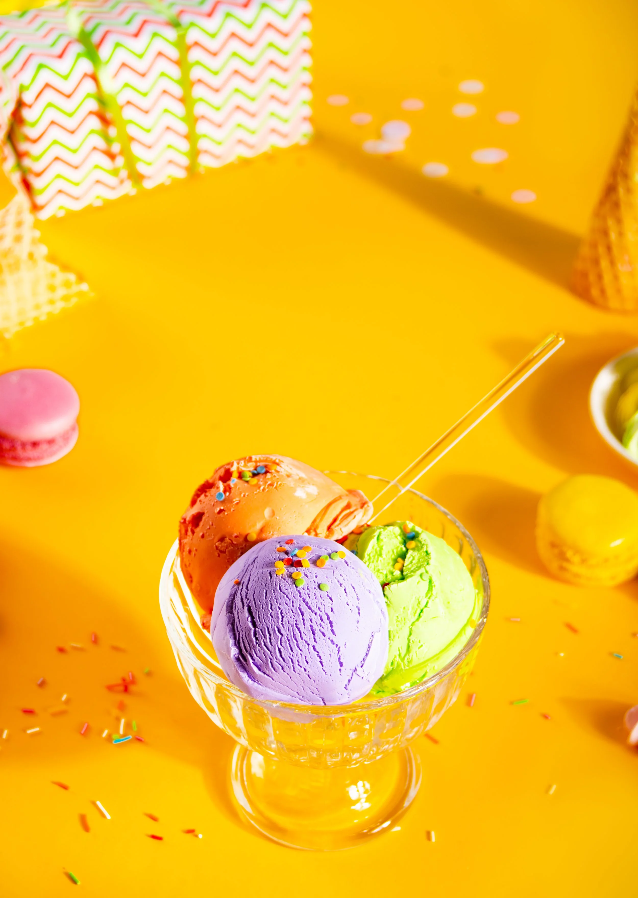 colorful-ice-cream-cones-and-macarons-on-yellow-2026-01-06-10-01-03-utc.jpg