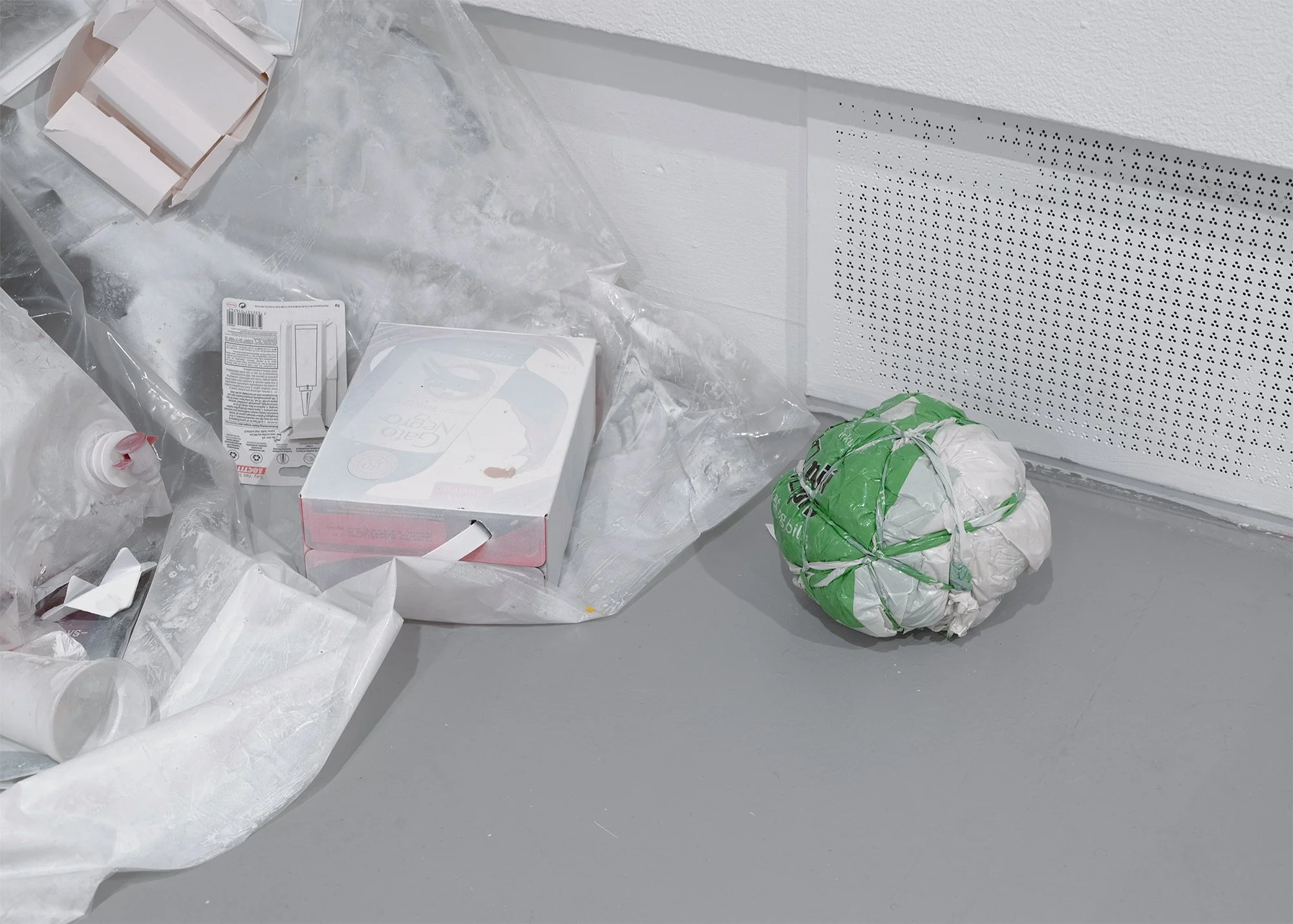 The ball, video installation, 2024, analog monitor, plastic, trash, cans, syringe, size variable 