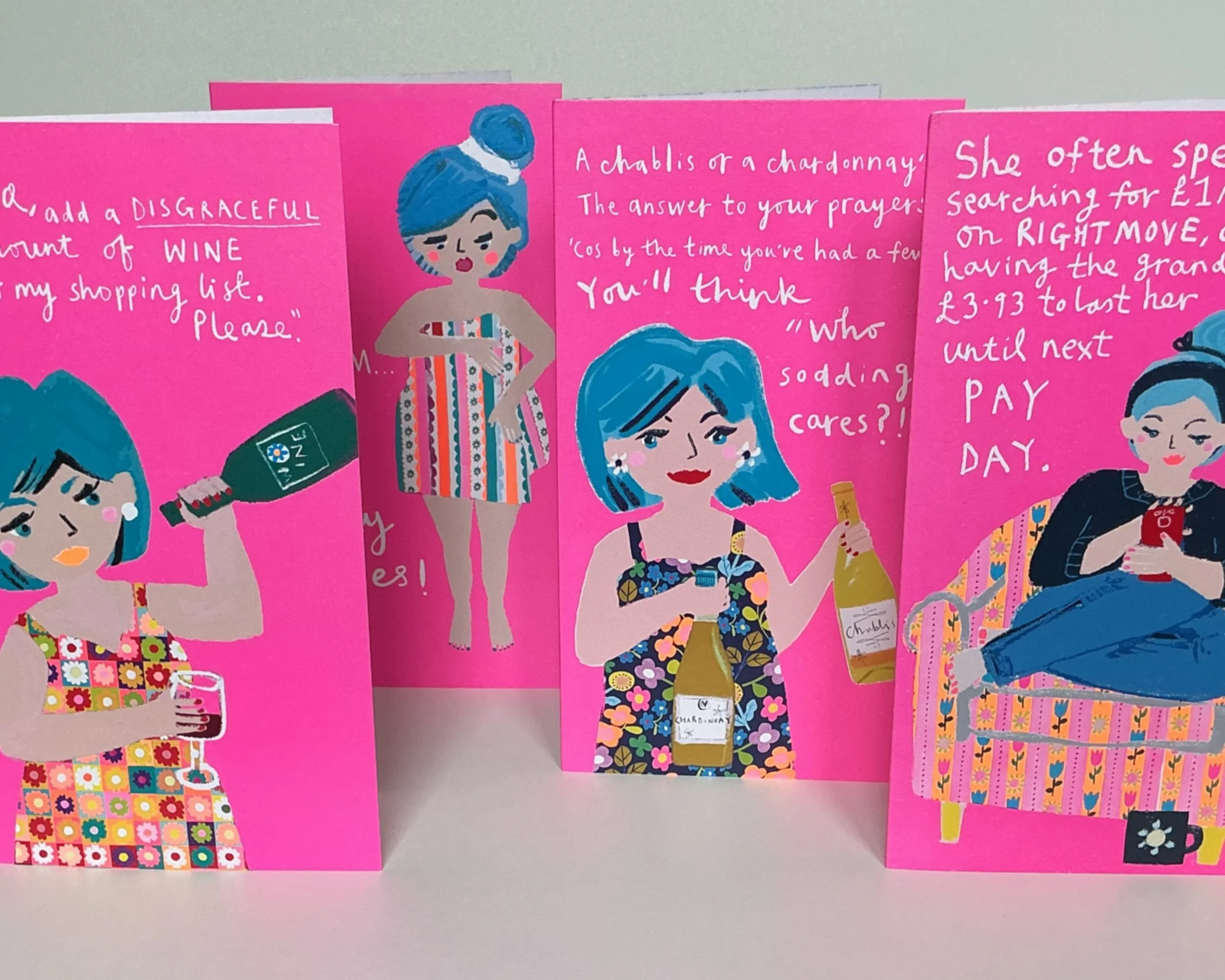 Range of Hillary cards. Hillary has blue hair.