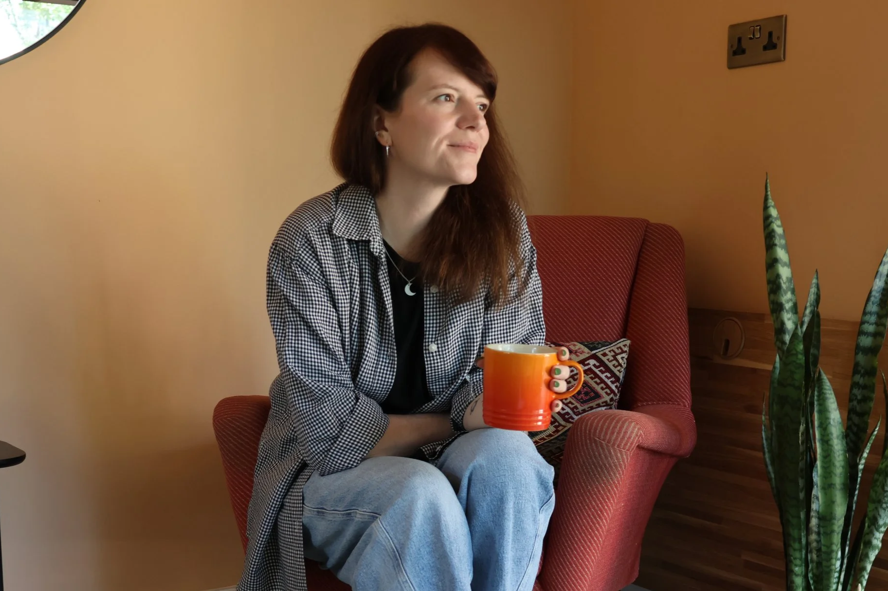 Jodie Morrison, integrative counsellor and psychotherapist, seated in the therapy room At Cedarwood Therapy, Adel, Leeds