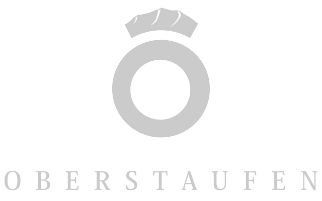 Logo mit einem Ring und einer Zange darüber, darunter das Wort 'Oberstaufen'