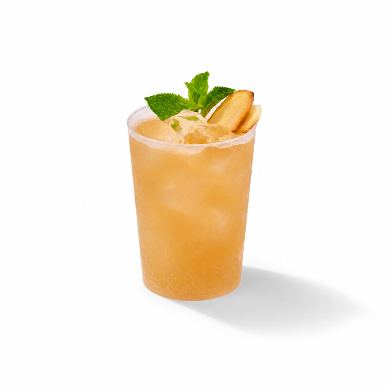 A plastic up with yellowish juice, called ginger drink