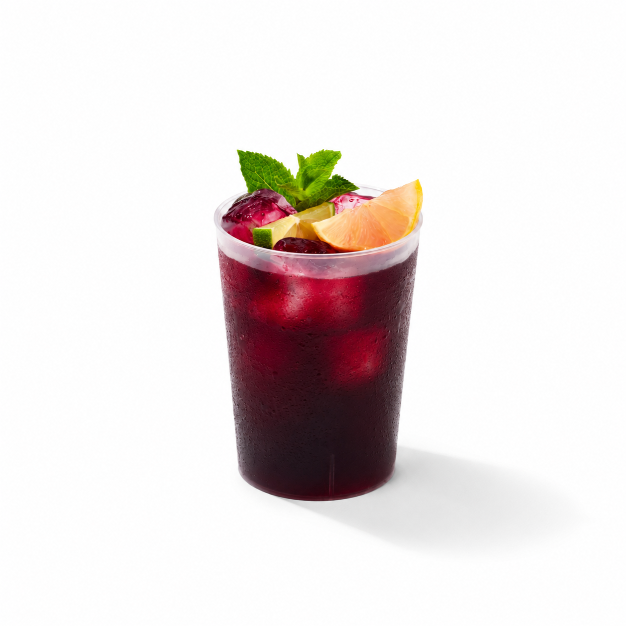 A plastic cup with a purple reddish drink called bissap