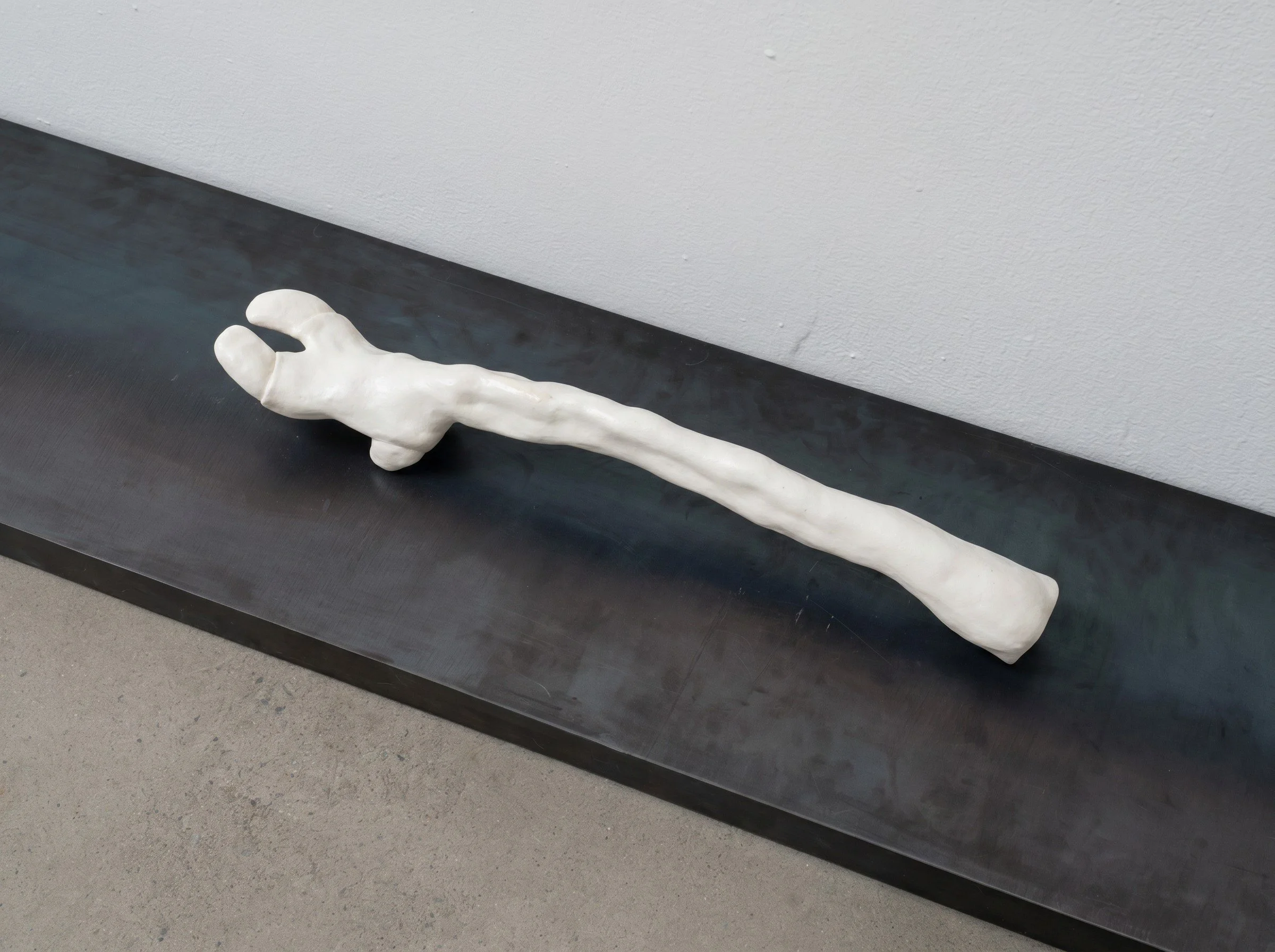Trophy Leg, 2026. Porcelain and steel, 68 x 12 x 7 in