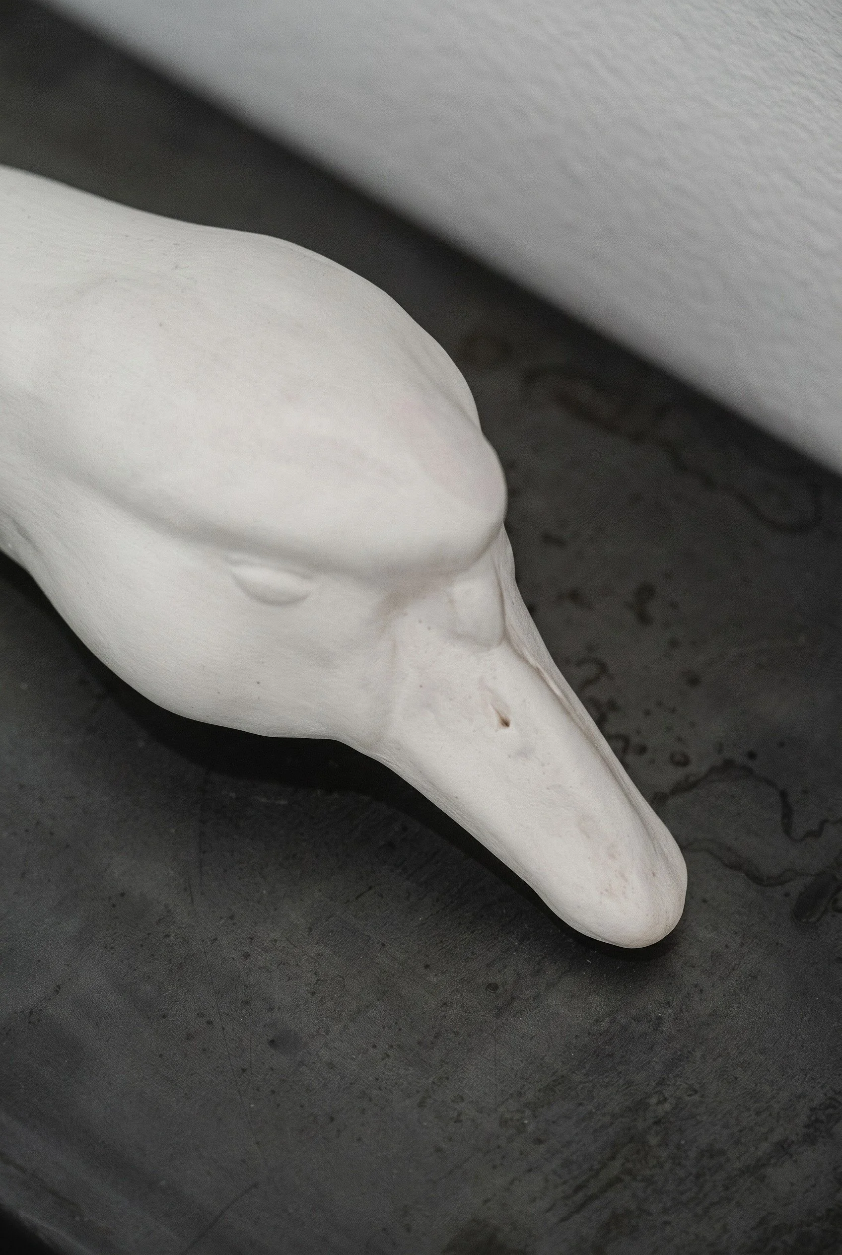 Head Rest (details), 2026. Porcelain and steel, 20 x 8 x 11 in