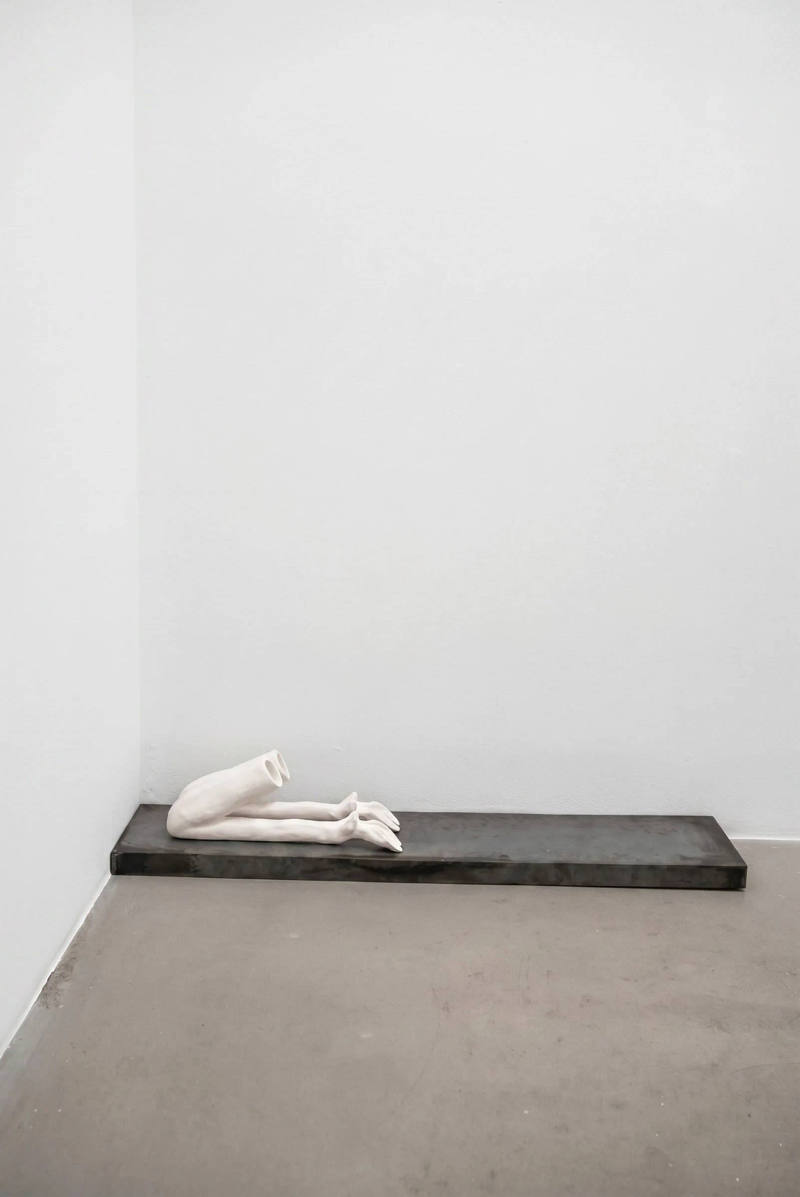 Prescribed Posture, 2026. Porcelain and steel ― 52 x 12 x 11 in