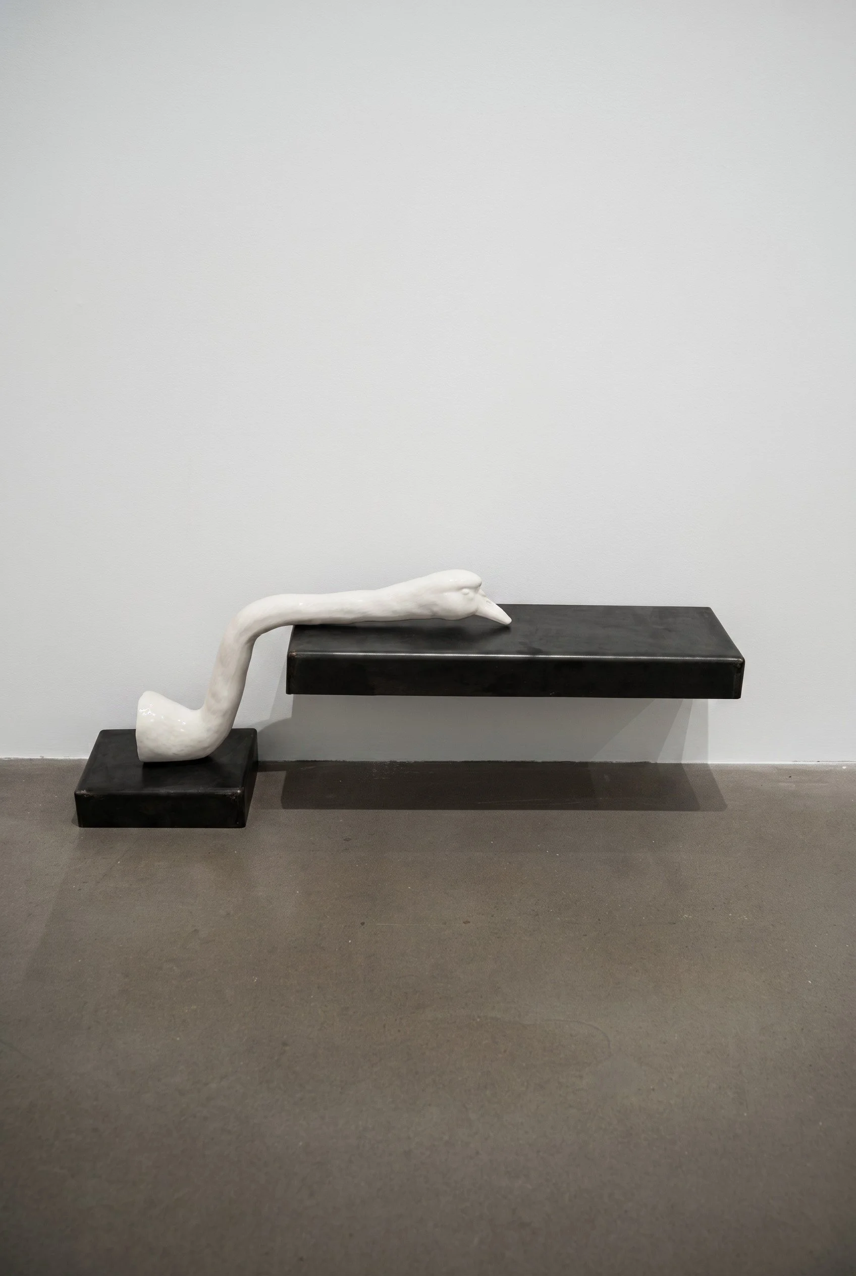 Head Rest, 2026. Porcelain and steel, 20 x 8 x 11 in