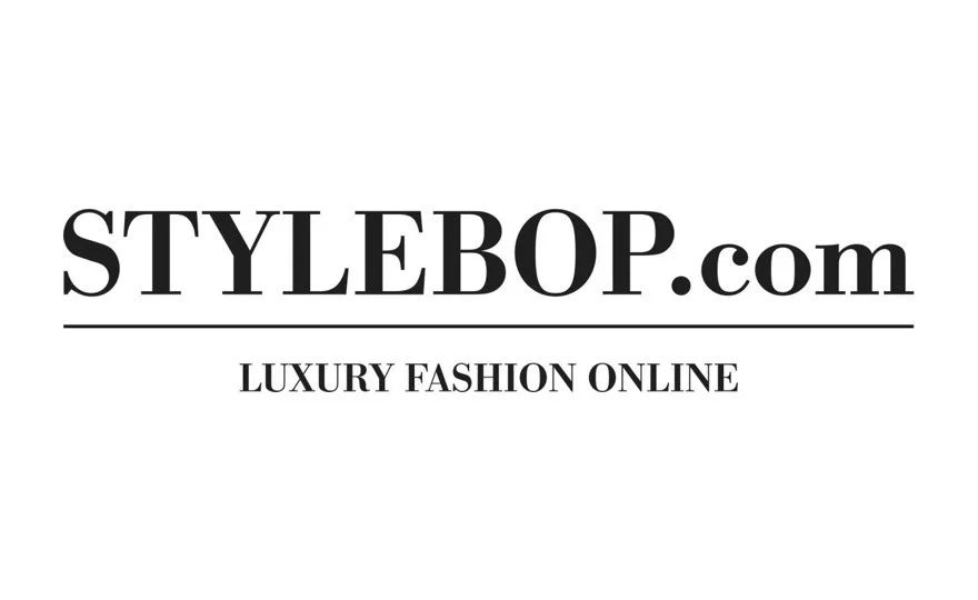 Black and white logo for STYLEBOP.com, a luxury online fashion retailer, with the tagline "Luxury Fashion Online."