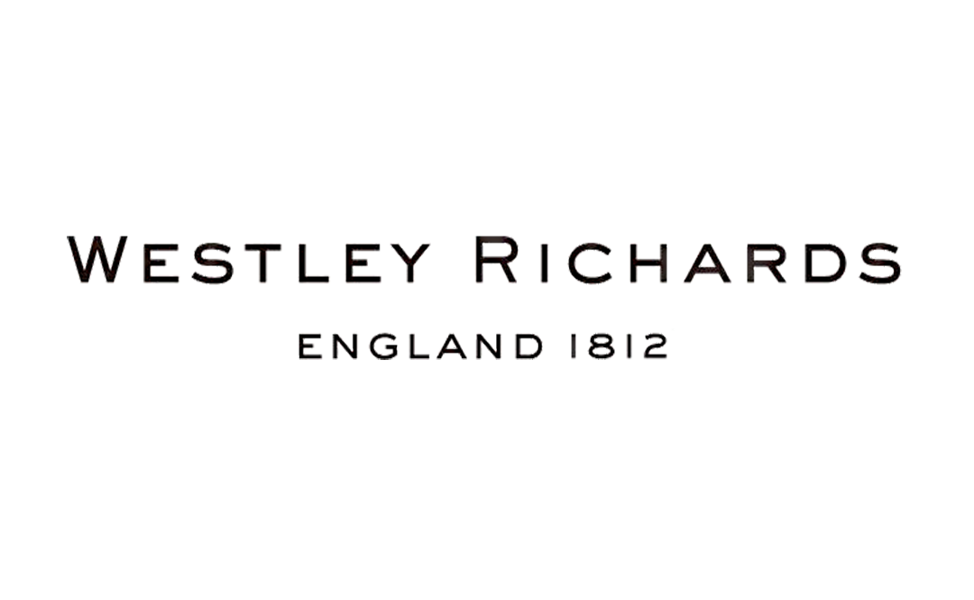 Image of text reading 'WESLEY RICHARDS ENGLAND 812' with a blurred background.