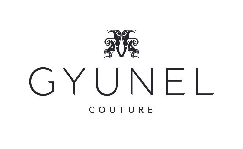 Logo with a decorative emblem above the text 'GYUNEL COUTURE' in black on a white background.