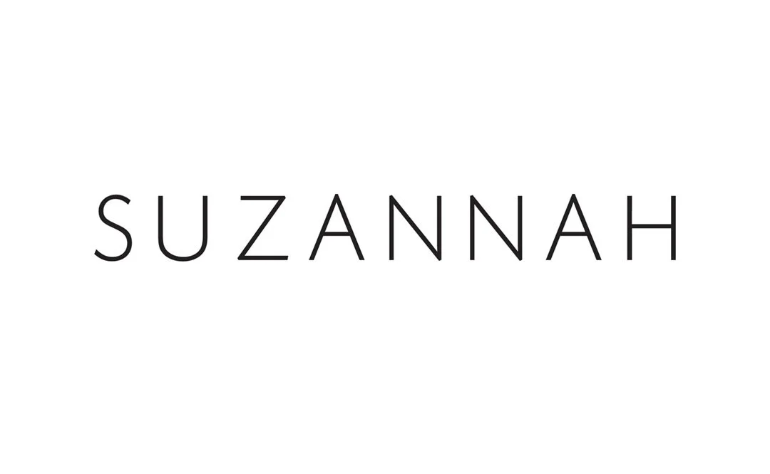 The word 'SUZANNAH' in black capital letters on a white background