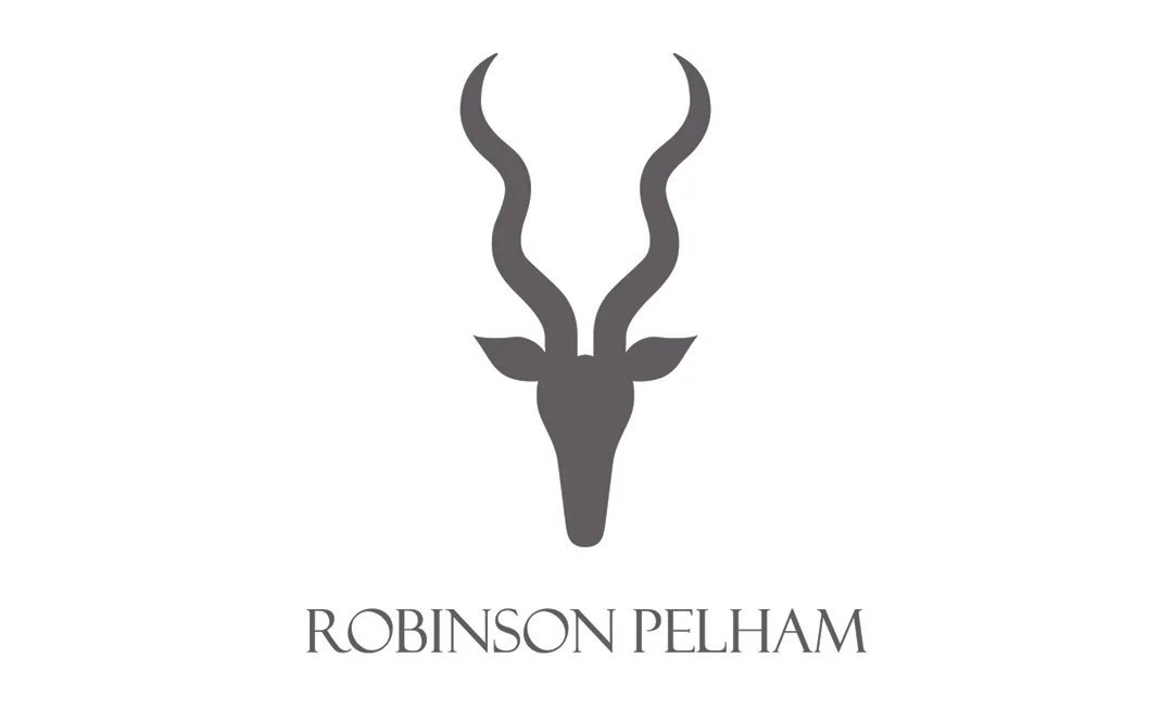 A stylized black and gray silhouette of an antelope's head with curved horns, and the text 'Robinson Pelham' below it.