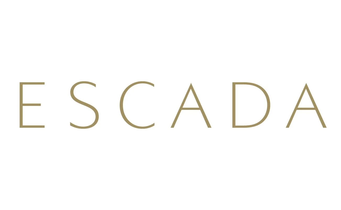 The word 'ESCADA' written in large, gold-colored letters on a white background.