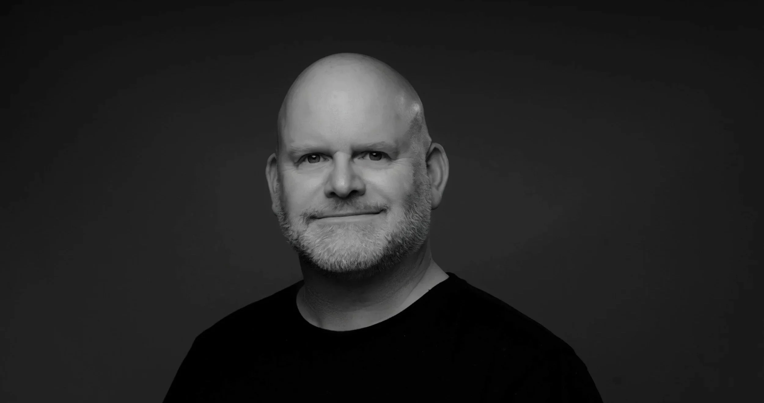 Black and white portrait image of Rich Baker